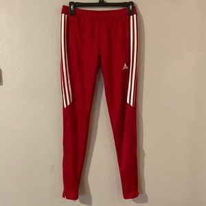 Red Adidas Tiro pants, size XS
